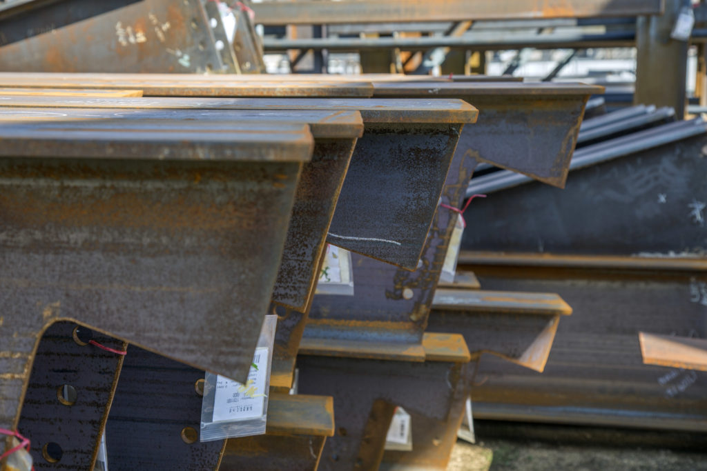 Structural beams with mill scale on them stack on top of each other